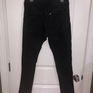 Faded black distressed skinny jeans